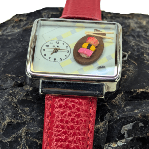 Close-up of the Minimalist Watch with Red Leather Strap and Clear Dial