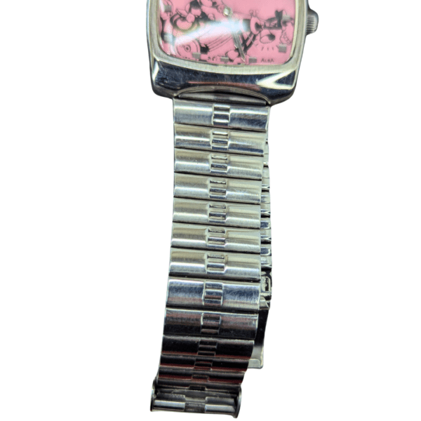 Close-up of a unique Disney-themed Mickey Mouse watch with a pink retro dial and stainless steel strap.