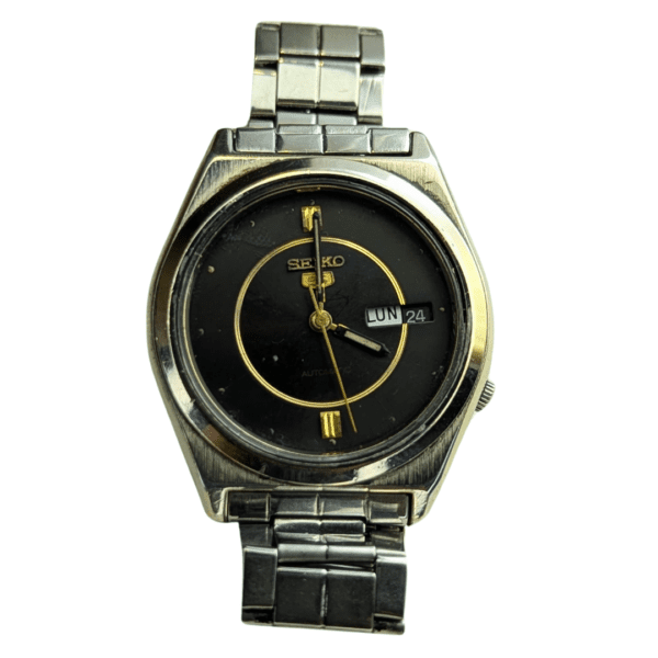 Vintage Seiko 5 automatic watch with black dial and gold accents